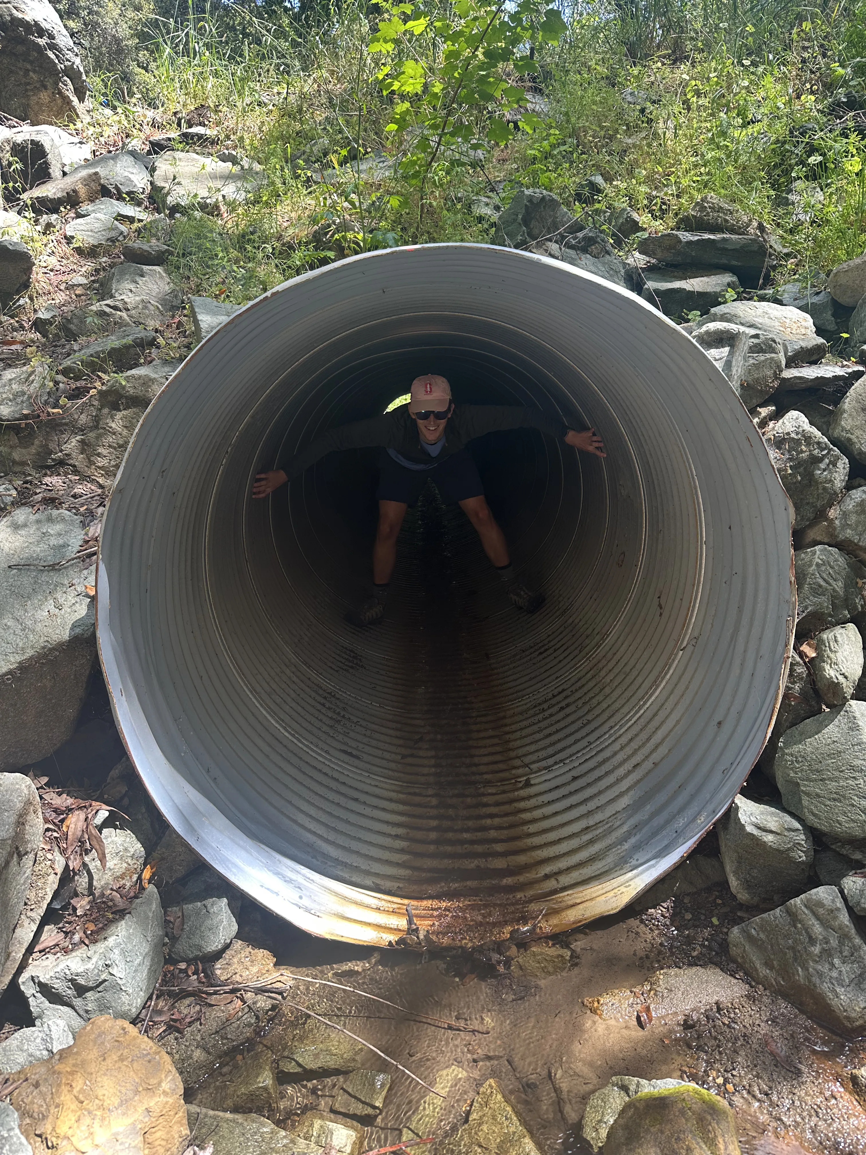 Ben climbing in culvert